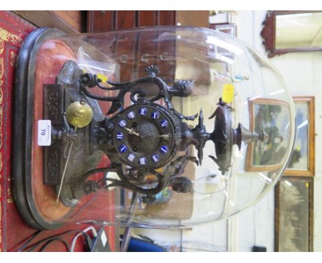 A late Victorian cast mantel clock, with blue enamel chapters, in a glass dome, dome 39cm high