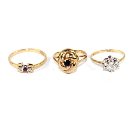 A set of three gem set rings, diamond ruby and sapphire