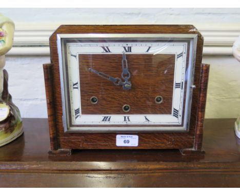 A 1930s oak mantel clock with square dial, the British Anvil three train movement striking on gongs, 27.5cm wide