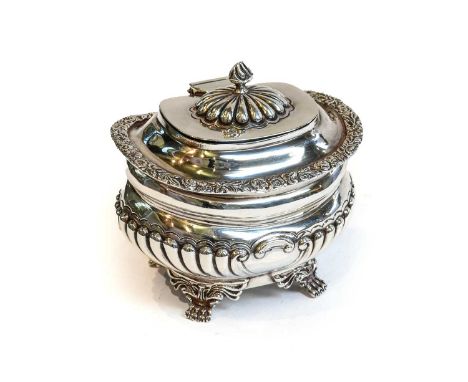 A Victorian Silver Tea-Caddy, by William Gibson and John Lawrence Langman, London, 1898, oval and on four scroll and paw feet