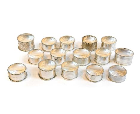 A Collection of Twelve Various Silver Napkin Rings, variously decorated, including a set of four with engine turned decoratio