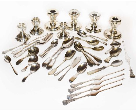 A collection of assorted silver and silver plate, the silver including: seven small candlesticks, filled; a Victorian caddy s