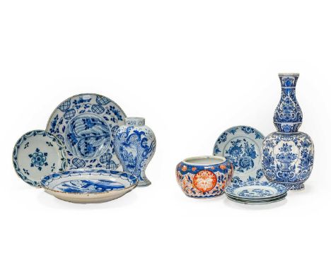 A quantity of 18th century and later Continental Delft, including chargers, vases, pancake plate, together with three 18th ce