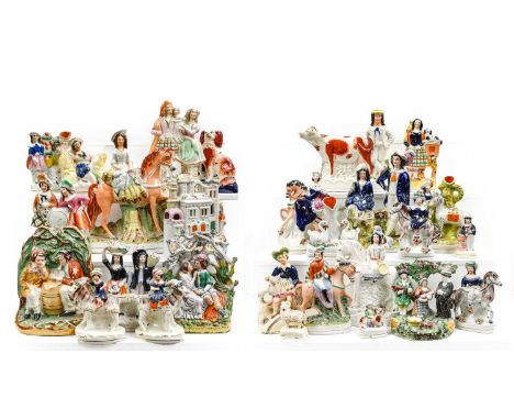 A quantity of mainly Victorian Staffordshire pottery flatback figures, portrait figures and spill vases including a tithe gro