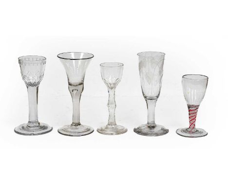 Five Georgian glasses comprising three wine glasses, one having double opaque and red twist stem, a cordial glass with facete