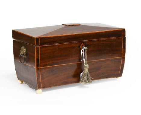 A Georgian mahogany sarcophagus shaped tea caddy with key (restored)