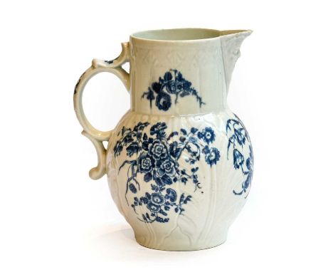 A Worcester leaf moulded mask jug, printed in underglaze blue with the three flowers pattern, hatched crescent mark circa. 17