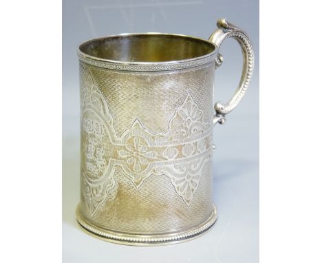 VICTORIAN SILVER PRESENTATION TANKARD, London 1868 with scroll handle and engine turned and relief decoration, the central ca