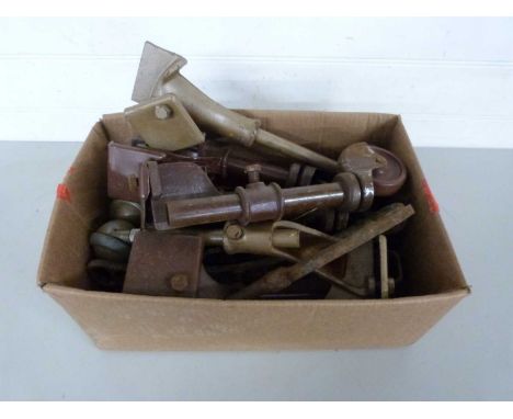Box of vintage iron wheels probably from beds
