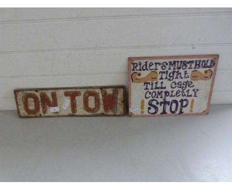 Vintage metal sign "On Tow" together with a further metal sign from a fairground