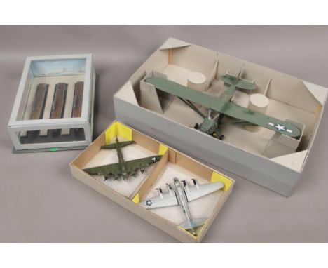 A group of World War II military kit built models including World War II Navy aircraft carriers, Piper L - 4 grass hopper etc