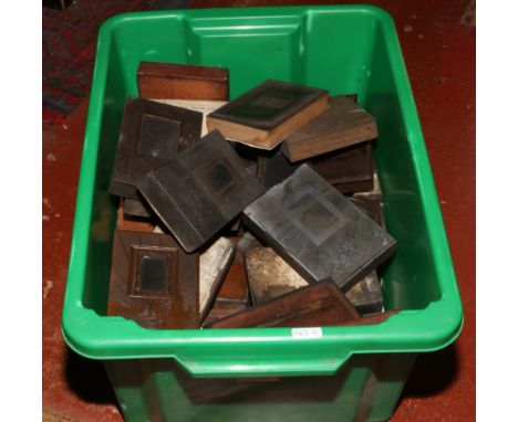 A box of vintage copper printing blocks.