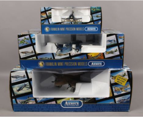 Three boxed Franklin Mint armour collection Diecast metal model aircraft including Douglas Dauntless.