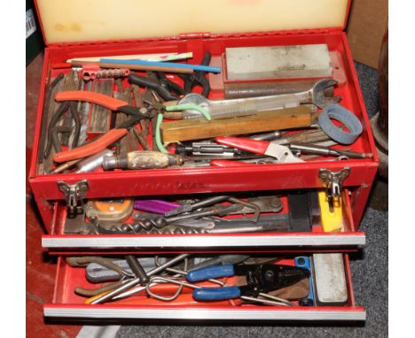 A red metal tool box and contents of various tools to include wrench, screwdrivers, spanners etc.
