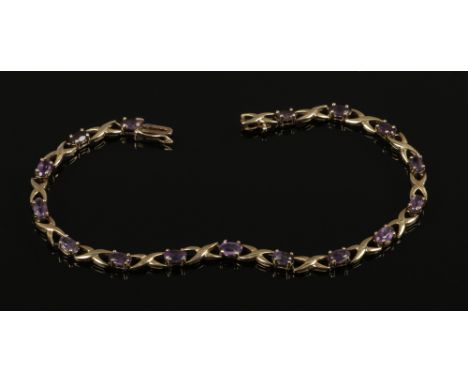 A 9ct gold and amethyst line bracelet.