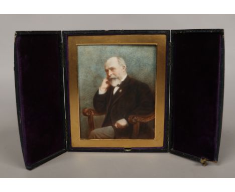 A leather cased painted portrait of a bearded gentleman.