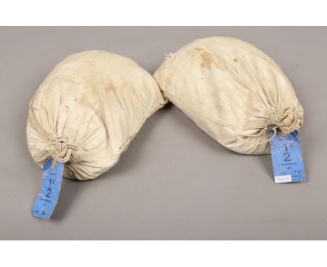 Two crimped lead sealed bags with crown logo of vintage 1/2D half penny coins.
