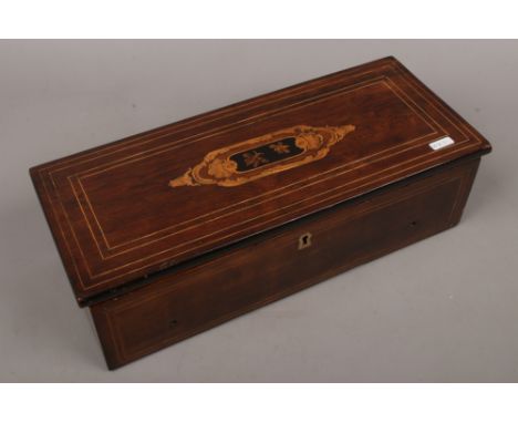 A Victorian inlaid music box.Condition report intended as a guide only.In need of restoration comb with four missing teeth an