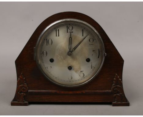 An oak Westminster / Whitington chime mantel clock with silvered dial, pendulum and key with original owner notes.