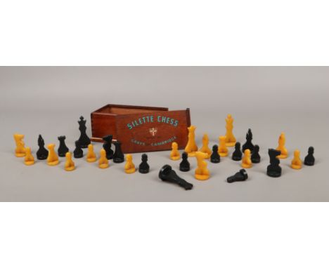 A complete cased Bakelite chess set made by The Gray of Cambridge.