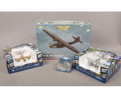 Four boxed Diecast metal model aircraft including P - 51 Mustang PBY - 5 Catalina 'black cat' from The Franklin Mint armour c