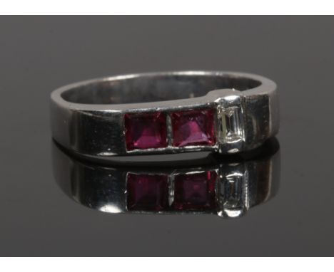 An 18ct white gold three stone ruby and diamond set ring, size M 1/2.