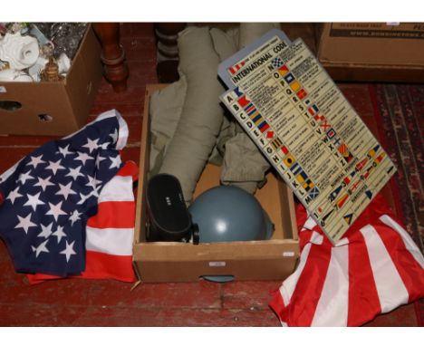 A group of reproduction military items including, a US Navy steel helmet, U.S Navy Kapok life jacket, code flag answering pen