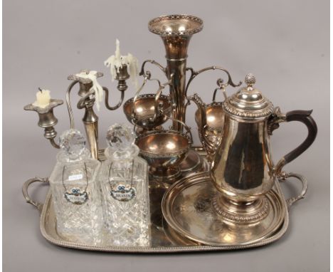 A tray of silver plate to include table centre piece, candelabra, two decanters, coffee pot etc.