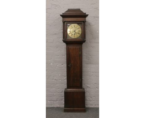 A Georgian oak 30 hour longcase clock with brass dial signed John Woodall / Willis Harthill with Roman numeral markers, date 