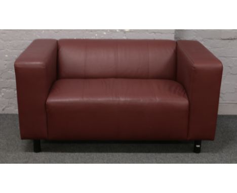 A brown leather two seat sofa. (Height 71cm, Width 140cm, Depth 80cm).Condition report intended as a guide only.Overall good 