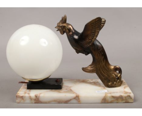 An Art Deco Spelter and marble table lamp surmounted with a cockerel.