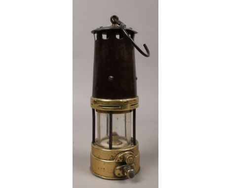 A brass based miners lamp.