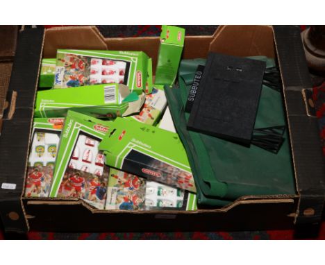 A box of Subbuteo accessories to include players, officials, score board, football playing pitch, corner flags etc.