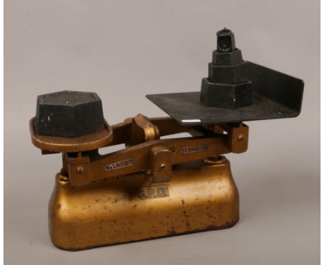 A set of G.P.O 7lb scales and weights by W &amp; T Avery Ltd Birmingham.