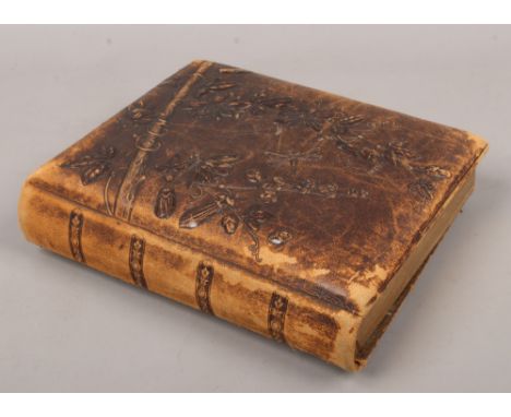 A Victorian photograph album and contents of monochrome portrait photographs.