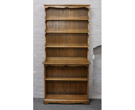 An Ercol Golden Dawn display dresser, 93cm wide x 37cm deep x 192cm high.