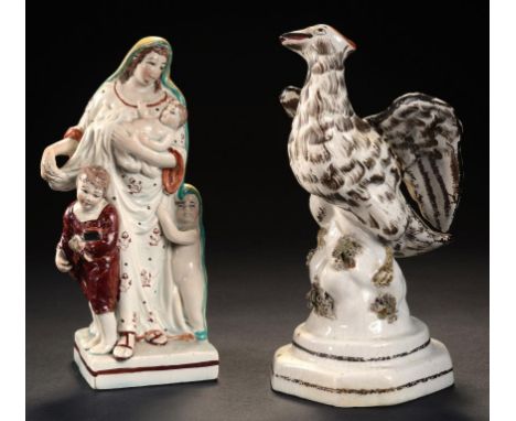 A STAFFORDSHIRE PEARLWARE GROUP OF CHARITY AND A STAFFORDSHIRE EARTHENWARE MODEL OF AN EAGLE, EARLY AND MID 19TH C 18.5 & 19.