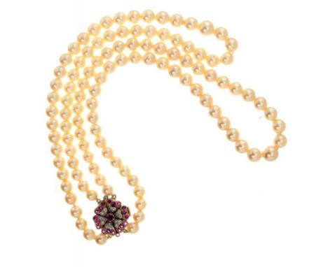 A CULTURED PEARL TWO ROW NECKLACE of 110 cultured pearls ranging from approximately 0.6-0.9cm, with ruby and diamond clasp ++