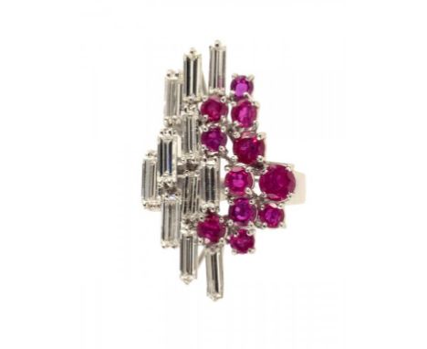 A RUBY AND DIAMOND COCKTAIL RING with baguette cut diamonds in 18ct white gold, 10.8g, size Q ++As good as new with hardly an