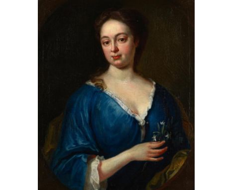 CIRCLE OF WILLIAM AIKMAN PORTRAIT OF A LADY  bust length in a blue dress, holding a sprig of white flowers, feigned oval, oil