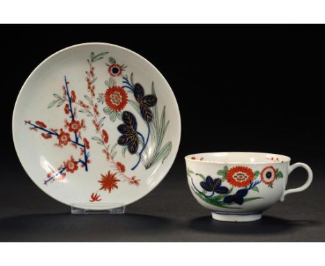 A WORCESTER IMARI TEACUP AND SAUCER, C1768-70  saucer 13cm diam, fretted square ++Both in fine condition with some very light