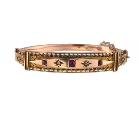 A RUBY AND DIAMOND BRACELET, 1908 in 9ct gold, gypsy set, by Henry Pope of Birmingham, Chester hallmark, 11.5g ++Lower part o
