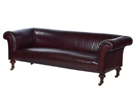 A VICTORIAN LEATHER CHESTERFIELD SOFA  on turned mahogany feet with brass castors, re-upholstered in dark red-brown hide, 70c