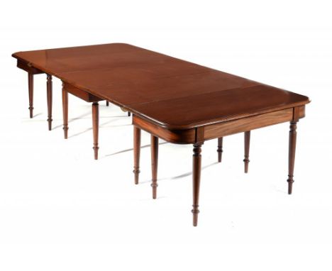 A MAHOGANY DINING TABLE, 19TH C  with gate legged centre section and three leaves, on lotus turned legs, 74cm h; 139 x 305cm 