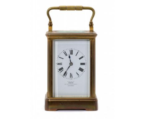 A FRENCH BRASS CARRIAGE CLOCK, C1900  the enamel dial inscribed EXAMINED BY DENT 33 COCKSPUR STREET LONDON,   the gong striki