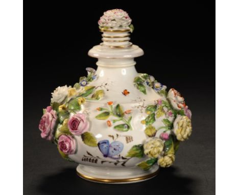 A ROCKINGHAM FLORAL ENCRUSTED BULBOUS SCENT BOTTLE AND STOPPER, C1830-42 14cm h, puce printed mark, Cl 2 in gilt For a simila