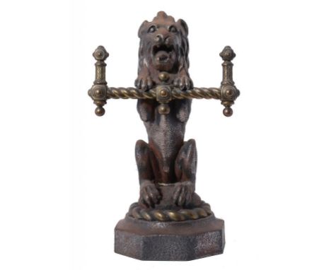 HEARTH FURNITURE.  A VICTORIAN BRASS MOUNTED CAST IRON LION IMPLEMENT REST, C1870 on octagonal foot, 39cm h ++Heavily pitted 