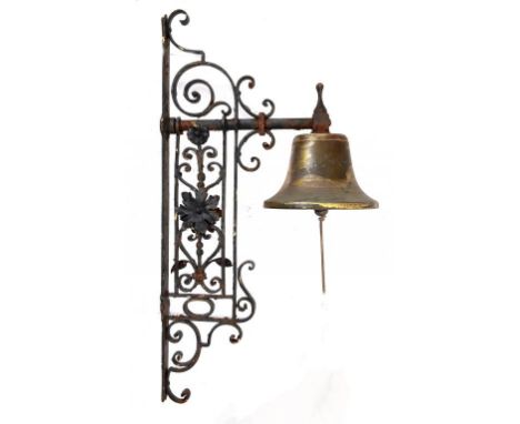 A VICTORIAN WROUGHT IRON WALL BRACKET AND BRASS BELL, C1900  wall plate 50cm h ++Old rust and tarnish but complete and requir