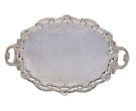 A VICTORIAN SILVER TEA TRAY  66.5cm over handles, by John Round & Son Ltd, London 1895 and marked for the retailer JAS RAMSAY