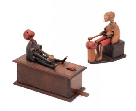 TWO JAPANESE CARVED AND PAINTED WOOD MECHANICAL KOBE TOYS, EARLY 20TH C in the form of man startled by a snake or a seated dr